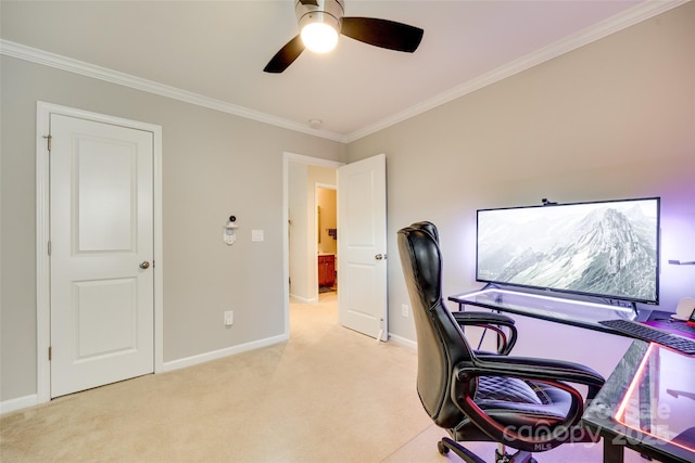 office with crown molding, baseboards, a ceiling fan, and light colored carpet