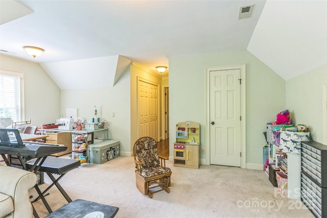 game room with baseboards, visible vents, light carpet, and lofted ceiling