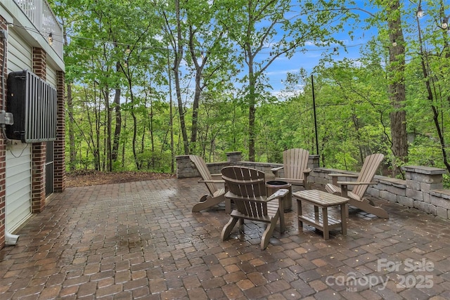 view of patio / terrace with a fire pit