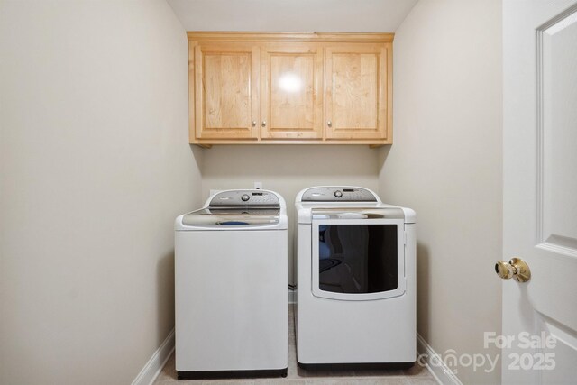 108 Ivy Ct, Morganton, NC 28655 - washroom with cabinet space, baseboards, and washing machine and dryer