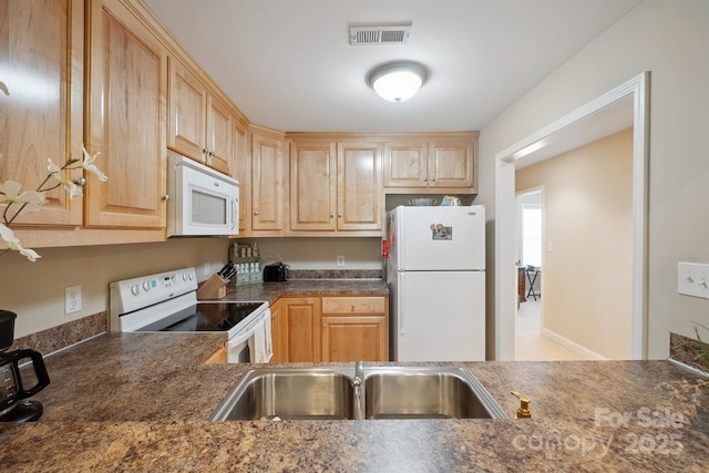 108 Ivy Ct, Morganton, NC 28655 - kitchen with visible vents, light brown cabinets, dark countertops, white appliances, and a sink
