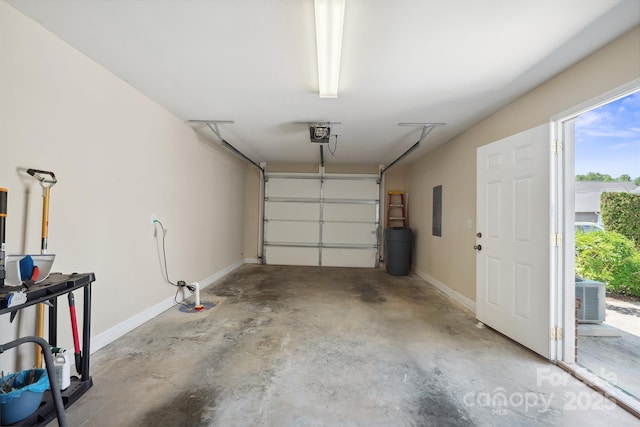 108 Ivy Ct, Morganton, NC 28655 - garage featuring baseboards, a garage door opener, central air condition unit, and electric panel