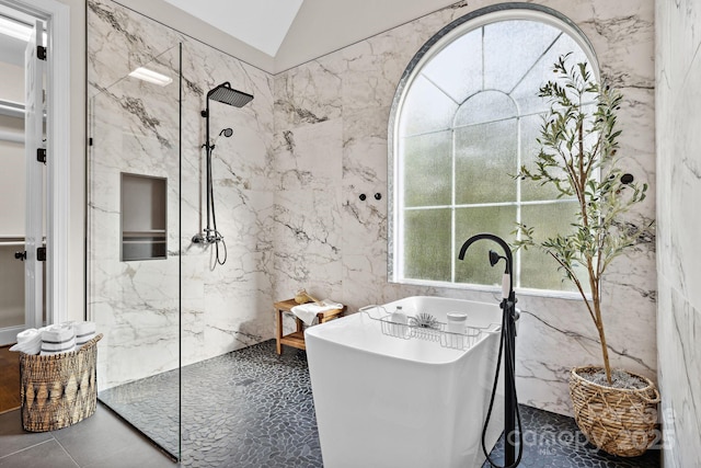 18730 Floyd Ct, Davidson, NC 28036 - bathroom featuring a soaking tub, a marble finish shower, tile walls, and lofted ceiling
