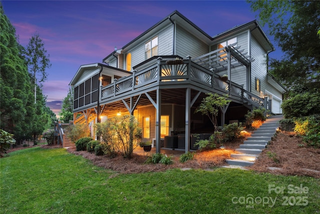 18730 Floyd Ct, Davidson, NC 28036 - rear view of property featuring stairs, a wooden deck, a yard, and a garage