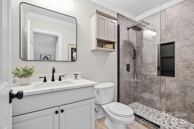 18730 Floyd Ct, Davidson, NC 28036 - bathroom with ornamental molding, vanity, a tile shower, and wood finished floors