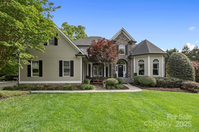 18730 Floyd Ct, Davidson, NC 28036 - view of front of house featuring a front yard, covered porch, stone siding, and roof with shingles