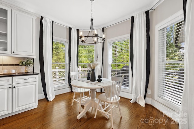 18730 Floyd Ct, Davidson, NC 28036 - dining area featuring a chandelier, dark wood-style flooring, and healthy amount of natural light