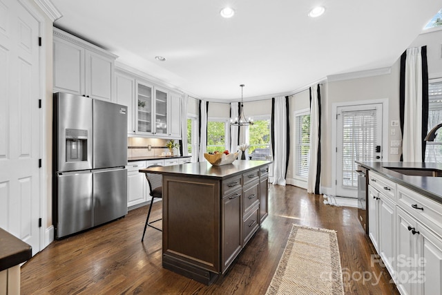 18730 Floyd Ct, Davidson, NC 28036 - kitchen featuring stainless steel fridge with ice dispenser, dark countertops, glass insert cabinets, white cabinets, and dark wood-style flooring