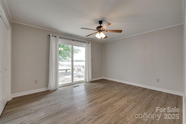 unfurnished room with ceiling fan, ornamental molding, and light wood-type flooring