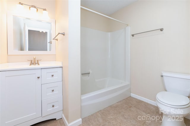 full bathroom with vanity, toilet, baseboards, tile patterned floors, and shower / bath combination