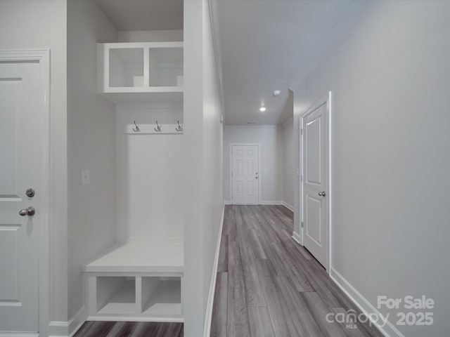 mudroom with baseboards, ornamental molding, recessed lighting, and wood finished floors