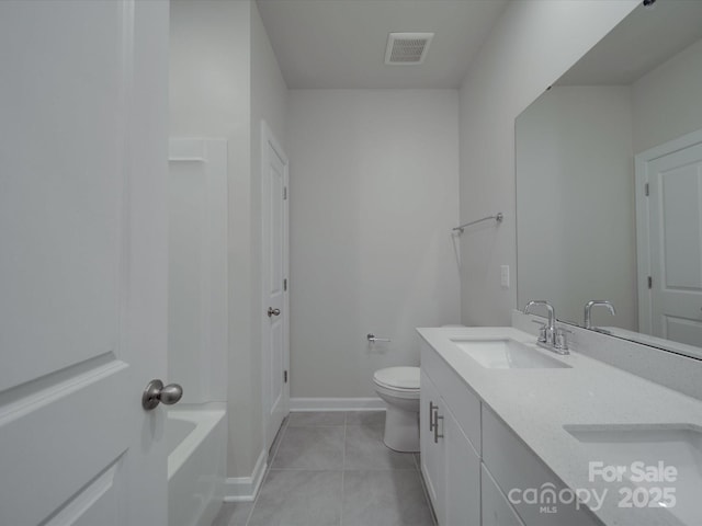 bathroom with a sink, tile patterned flooring, toilet, a tub to relax in, and visible vents