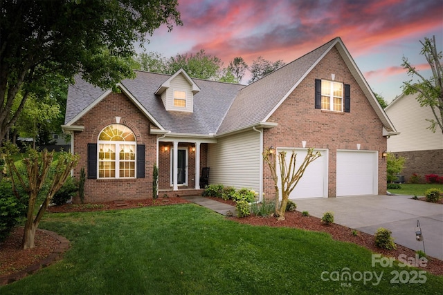 traditional-style home with a front yard, brick siding, driveway, roof with shingles, and an attached garage