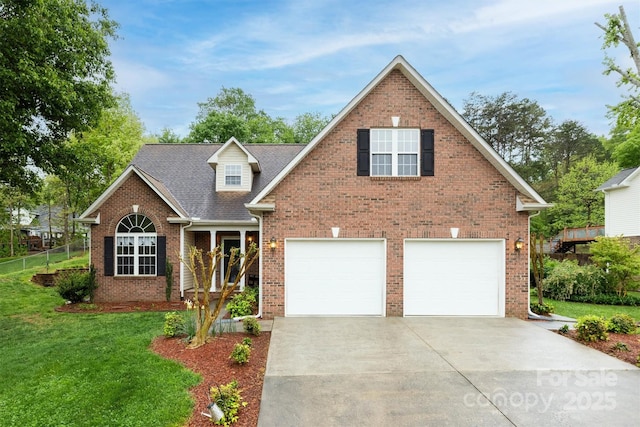 traditional home with brick siding, fence, a garage, a front yard, and concrete driveway