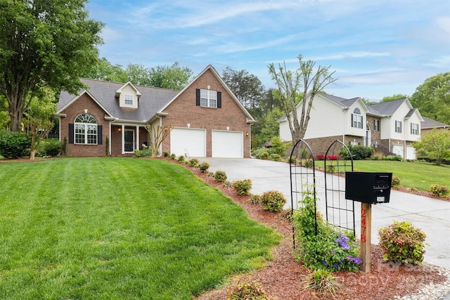 traditional-style house with a residential view, a front lawn, driveway, and brick siding