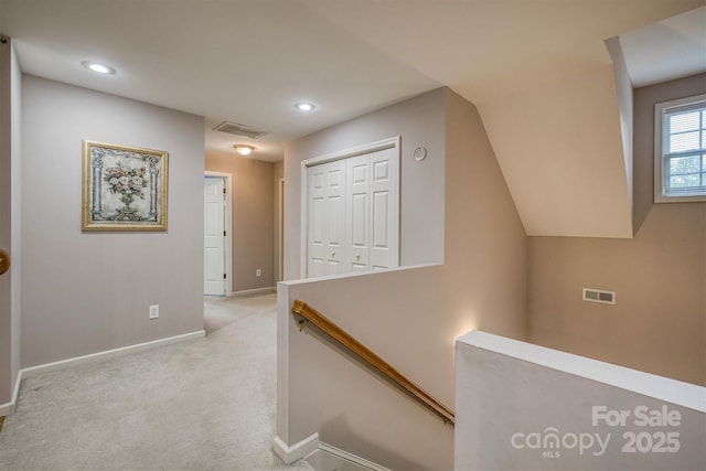corridor with recessed lighting, carpet floors, an upstairs landing, baseboards, and visible vents