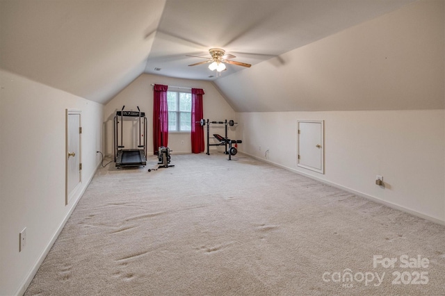 additional living space with carpet flooring, ceiling fan, lofted ceiling, and baseboards
