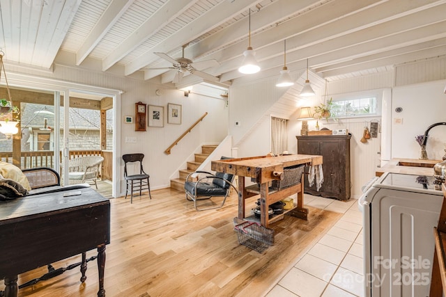 19 Castle St, Asheville, NC 28803 - living room with light wood-type flooring, beam ceiling, a ceiling fan, stairs, and separate washer and dryer