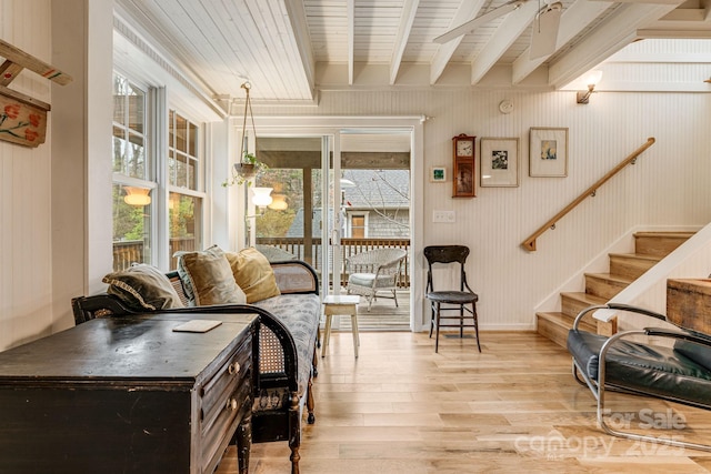 19 Castle St, Asheville, NC 28803 - living room featuring light wood-style floors, plenty of natural light, stairs, baseboards, and wood ceiling with exposed beams