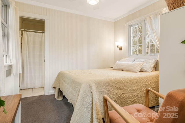 19 Castle St, Asheville, NC 28803 - carpeted bedroom with crown molding and tile patterned flooring
