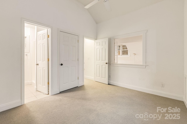 19 Castle St, Asheville, NC 28803 - unfurnished bedroom with carpet flooring, ensuite bath, baseboards, high vaulted ceiling, and a ceiling fan