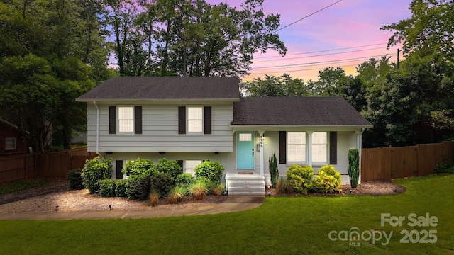 2100 Shadyview Dr, Charlotte, NC 28210 - split level home featuring brick siding, roof with shingles, and a gate