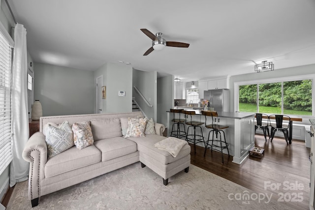 2100 Shadyview Dr, Charlotte, NC 28210 - living room featuring dark wood finished floors, a ceiling fan, and stairs