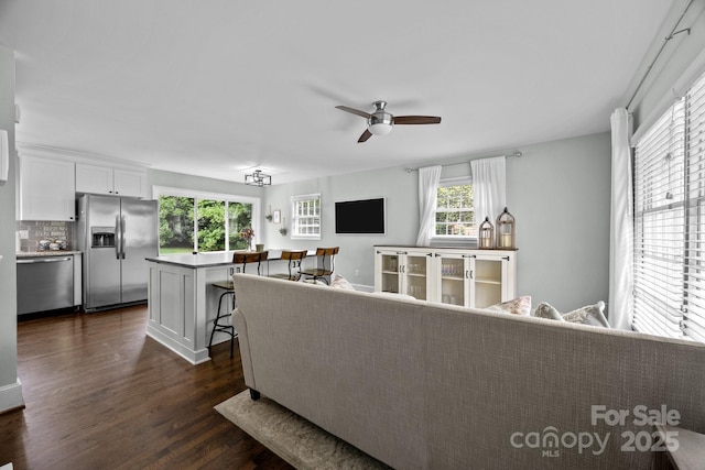 2100 Shadyview Dr, Charlotte, NC 28210 - living area featuring dark wood finished floors, healthy amount of natural light, and ceiling fan