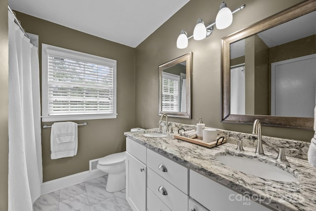 2100 Shadyview Dr, Charlotte, NC 28210 - full bath with marble finish floors, double vanity, toilet, and baseboards