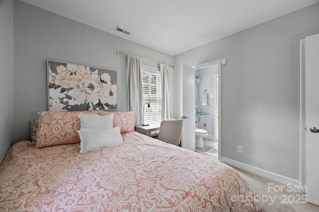 2100 Shadyview Dr, Charlotte, NC 28210 - carpeted bedroom featuring baseboards and connected bathroom