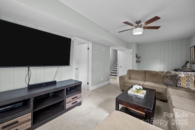 2100 Shadyview Dr, Charlotte, NC 28210 - living room with stairway, light carpet, a ceiling fan, baseboards, and wood walls
