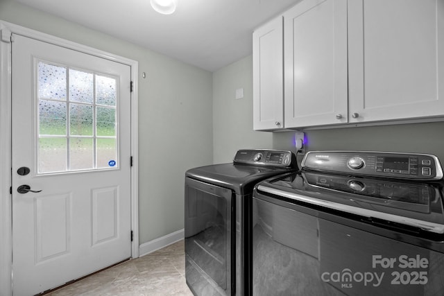 2100 Shadyview Dr, Charlotte, NC 28210 - laundry area featuring cabinet space, separate washer and dryer, and baseboards