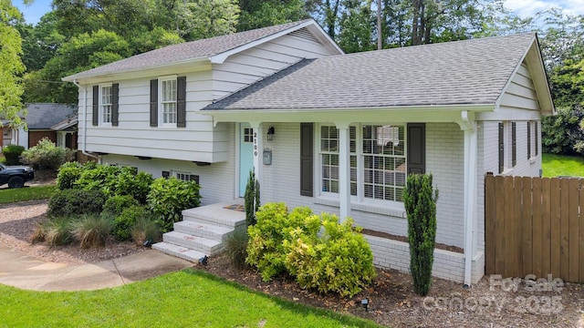 2100 Shadyview Dr, Charlotte, NC 28210 - split level home with a shingled roof and brick siding
