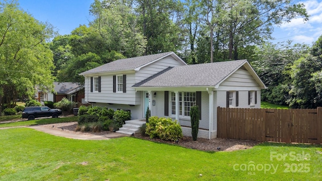 2100 Shadyview Dr, Charlotte, NC 28210 - tri-level home with roof with shingles and covered porch