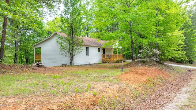 view of side of home with a deck