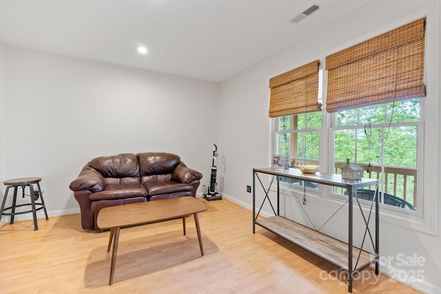 sitting room with baseboards, recessed lighting, light wood-style flooring, and visible vents