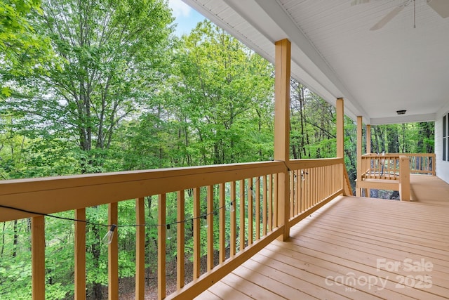 deck with covered porch and ceiling fan