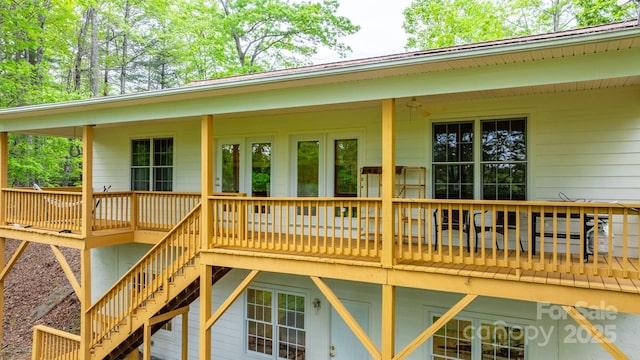 rear view of property with stairs