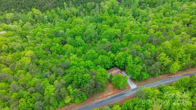 aerial view with a wooded view