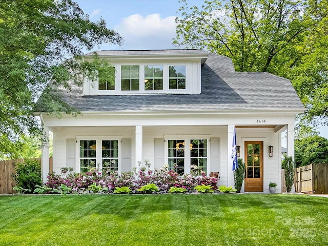 1614 Brook Rd, Charlotte, NC 28205 - view of front facade with fence, a shingled roof, and a front yard