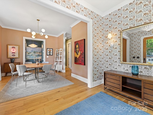 1614 Brook Rd, Charlotte, NC 28205 - dining space featuring wallpapered walls, baseboards, a chandelier, crown molding, and wood finished floors