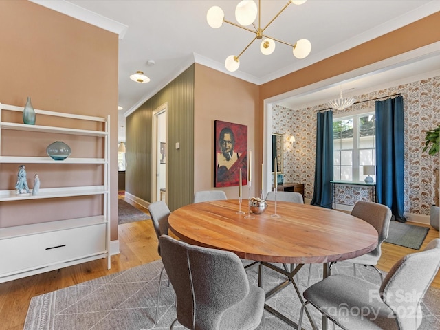 1614 Brook Rd, Charlotte, NC 28205 - dining area with baseboards, ornamental molding, a chandelier, and wood finished floors