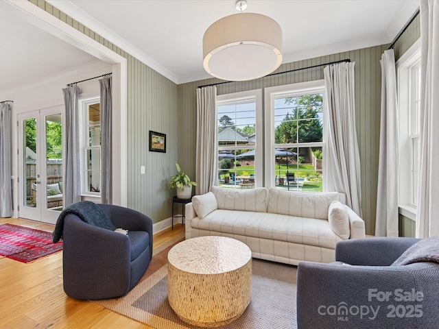 1614 Brook Rd, Charlotte, NC 28205 - sitting room with wood finished floors, plenty of natural light, french doors, and ornamental molding