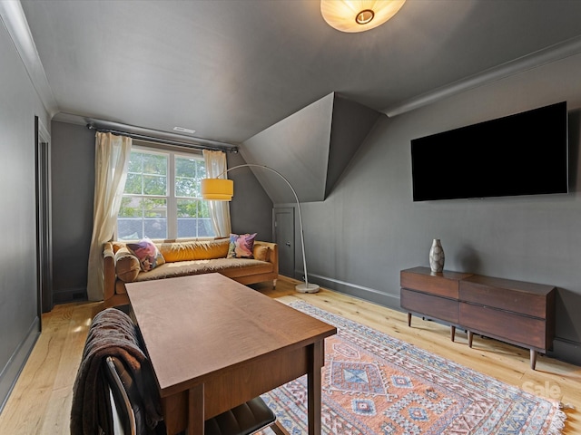 1614 Brook Rd, Charlotte, NC 28205 - living area with vaulted ceiling, crown molding, baseboards, and light wood-type flooring