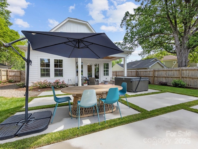 1614 Brook Rd, Charlotte, NC 28205 - rear view of house featuring a patio, a hot tub, and a fenced backyard