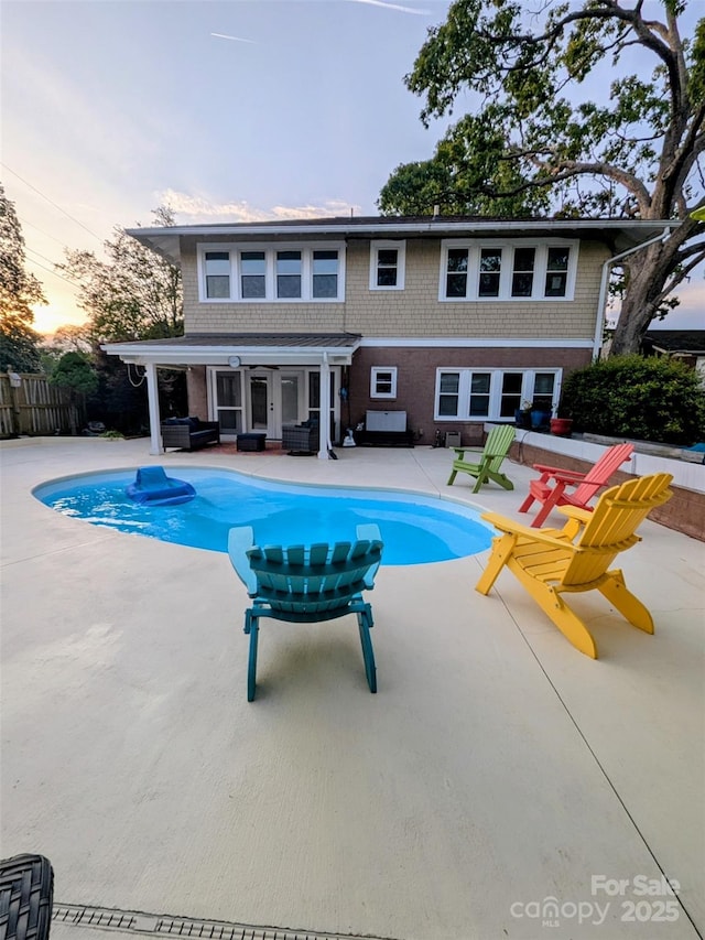 311 W Union St, Morganton, NC 28655 - pool at dusk featuring a patio, a fenced in pool, and fence