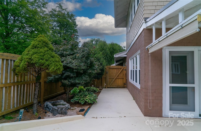 311 W Union St, Morganton, NC 28655 - view of property exterior with brick siding, a gate, and fence
