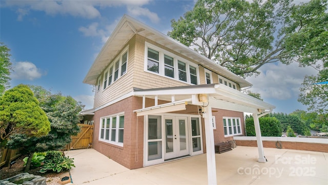311 W Union St, Morganton, NC 28655 - rear view of house with a patio, a gate, french doors, fence, and brick siding