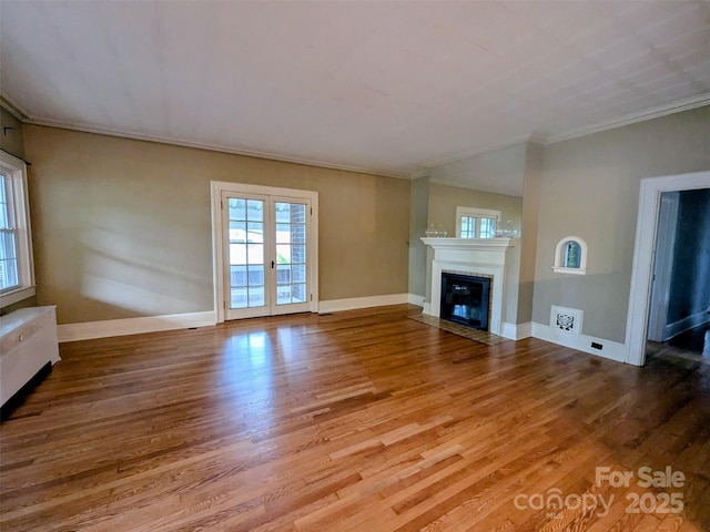 311 W Union St, Morganton, NC 28655 - unfurnished living room with a fireplace with flush hearth, wood finished floors, baseboards, and ornamental molding
