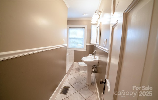 311 W Union St, Morganton, NC 28655 - bathroom with crown molding, toilet, visible vents, and tile patterned flooring